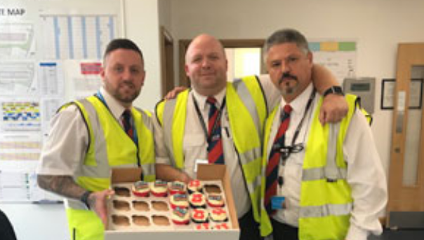 MAN Commercial Protection Ltd employees with cupcakes